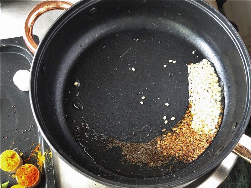 Tempering with mustard, cumin and lentils